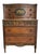 An exceptional early 20th-century Neoclassical chest-on-chest showcasing richly figured mahogany veneers, finely cast...