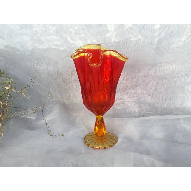 Display this Fenton Art Glass amberina vase by itself or grouped with other mid-century modern pieces. The vintage Fenton...