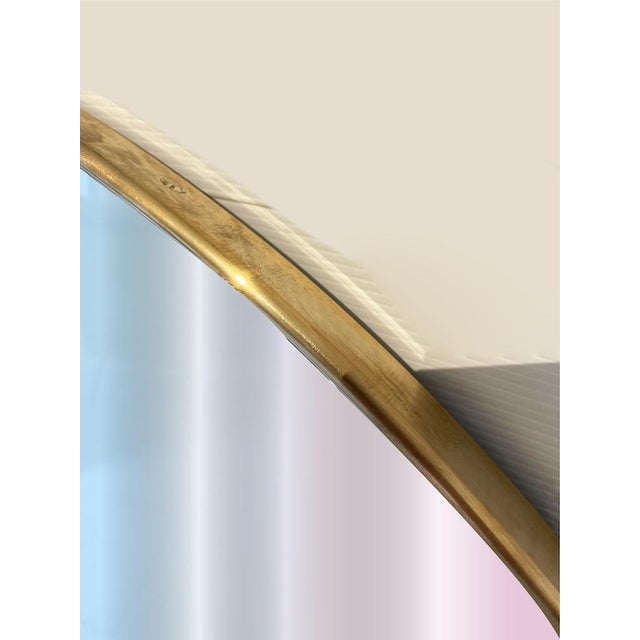 Elegant vintage mirror with an all-brass frame and wooden back. It features a convenient steel hook to ensure stability on...