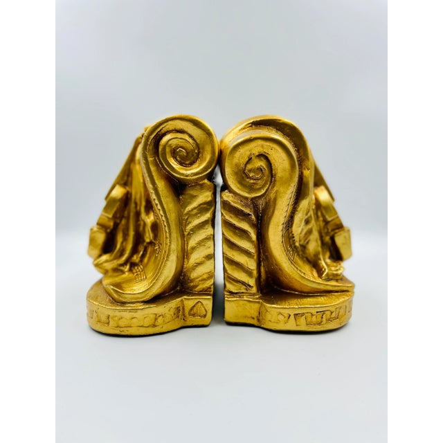 These treasures are perfect for the Maestro's office! The pair of golden and glamorous bookends from Progressive Art...