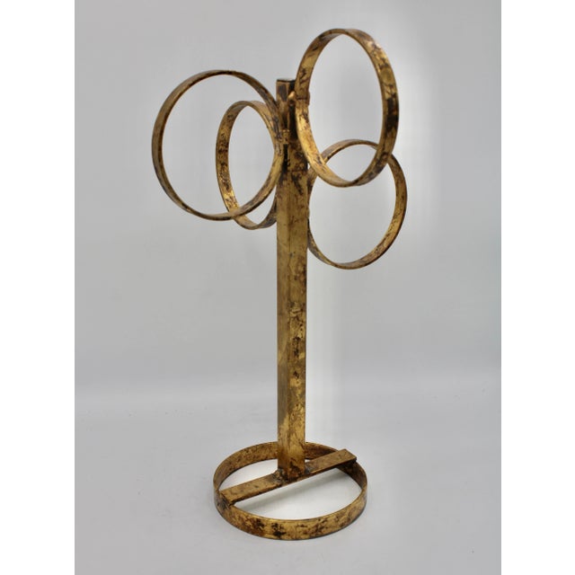 A stunning mid 20th century Italian gold gilded metal 4 ring towel rack. Lovely natural patina.