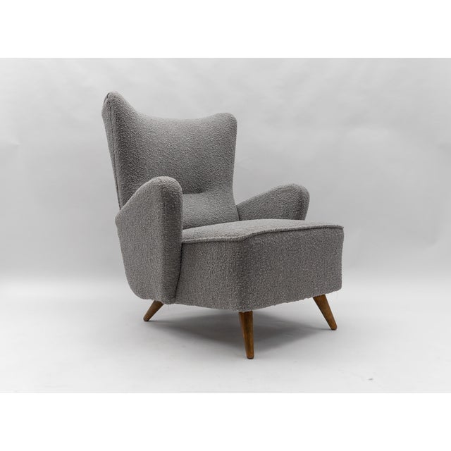 Awesome large wingback armchair. New upholstery in grey Boucle fabric. Seat height 43cm, total height 99cm. Seat width...