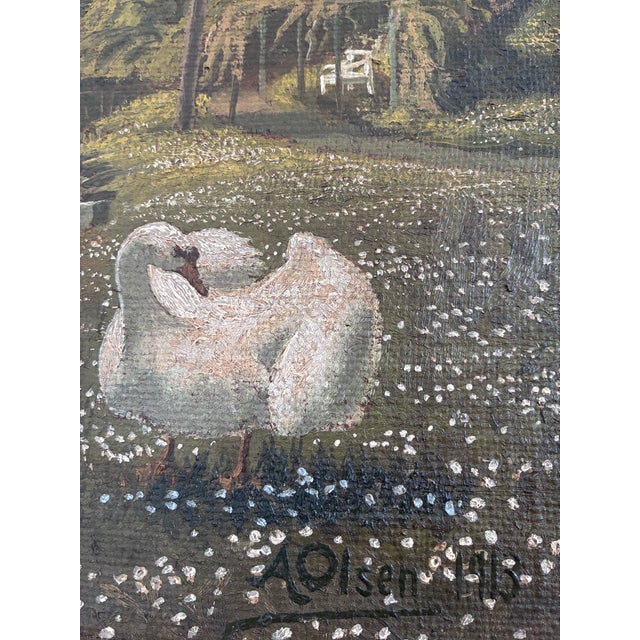 This original antique oil painting, dated 1913 on the back, shows two white swans in a romantic flower-filled garden...