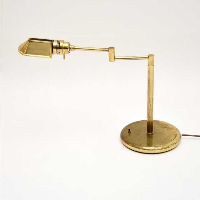 A stylish and very well made vintage brass desk lamp, made in England and dating from the 1970s. It is of superb quality...