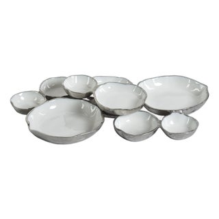 Cluster of Nine Round Serving Bowls with White Enamel Interior For Sale