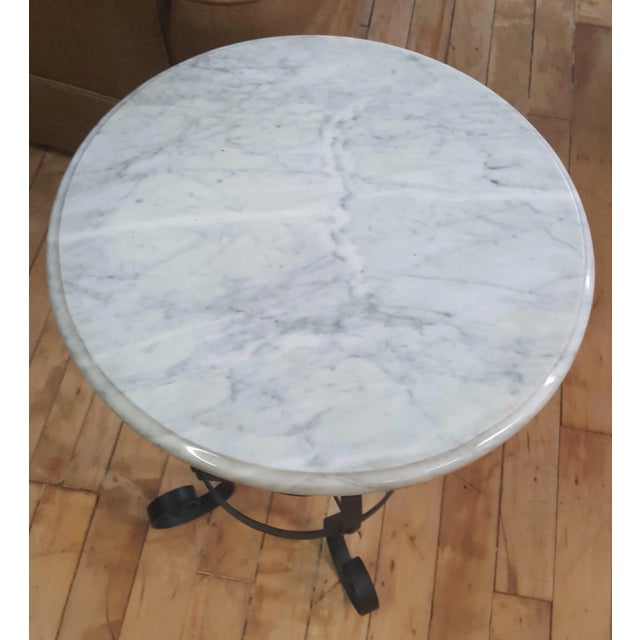 Maitland Smith table, with gray marble top. Wrought iron base. Handmade. Showroom sample in excellent condition. Original...