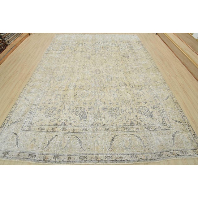 An authentic vintage traditional Tabriz rug hand-knotted with an all-wool pile on a cotton foundation. This oriental rug...