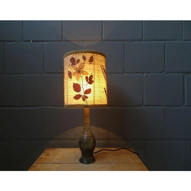 French table lamp from the 1960s / 1970s by jean tessier atelier du cep. Sculptural base of pyrite sandstone and a large...