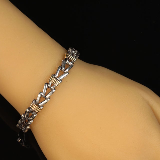 Unique Sterling Silver Herringbone Bracelet with Goldy Accents – 7.13 Inches Step up your jewelry game with this exquisite...