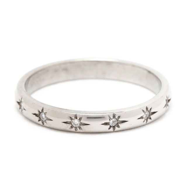 Stones: diamonds, 13 stones round brilliant cut 1 mm approximately .06 total carats G-H color, VS2-SI1 clarity Ring Size 5...