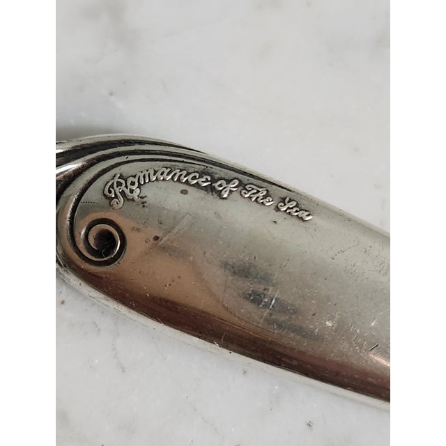 Sterling silver handle letter opener. An exquisite desk accessory. Coastal theme in design. Slim blade with sharp point....