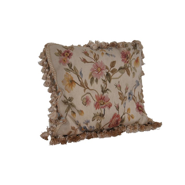 20th century square floral throw pillow, embroidered in wool with blue, pink, and yellow flowers on green-brown branches....