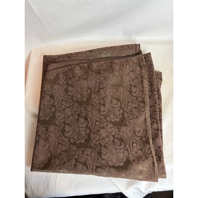 This gorgeous round tablecloth has wonderful floral like designs that blend in with the cloth. It is a very detailed table...