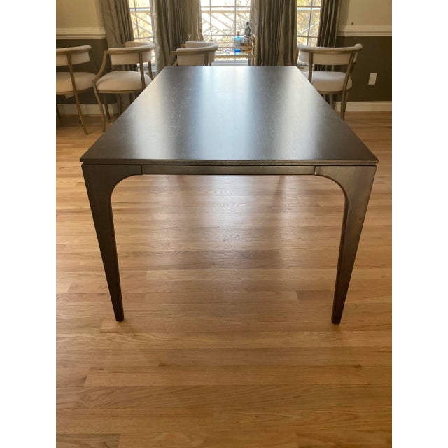 West Elm Adam Court Dining table in Mineral finish. Really nice transitional shape with parsons edge and a gentle curve at...