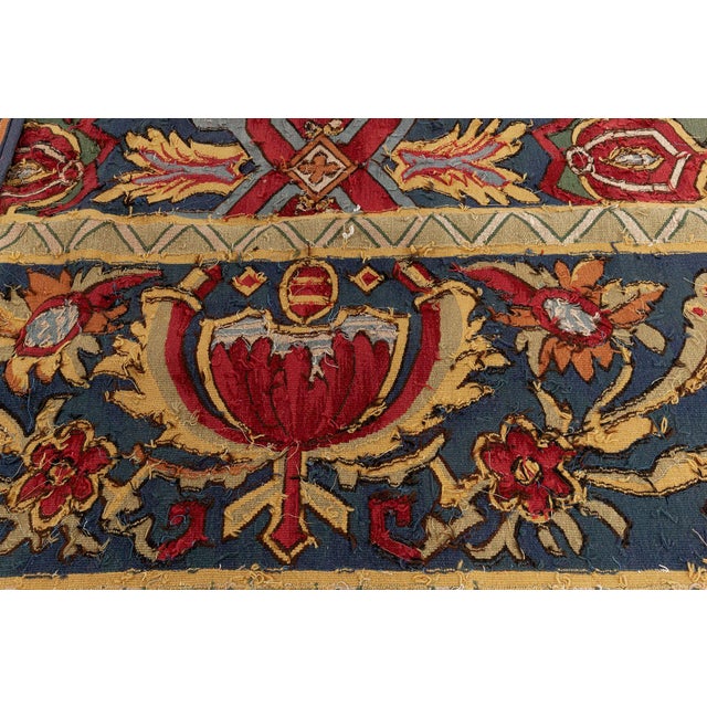 This magnificent French Aubusson rug, woven circa 1920, is a tour de force of color, craftsmanship, and classical European...