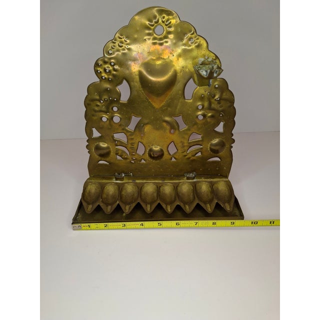 This is a museum-quality 18th-century Dutch brass Hanukkah lamp (Chanukiah) of the "Sheet Brass" variety, characterized by...