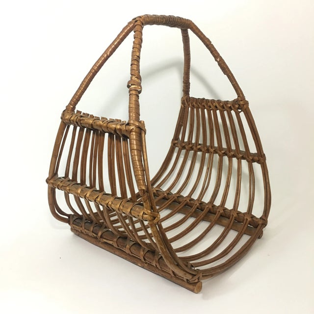 Vintage Franco Albini attributed magazine rack. In great vintage condition with a small repair to one of the arms but does...