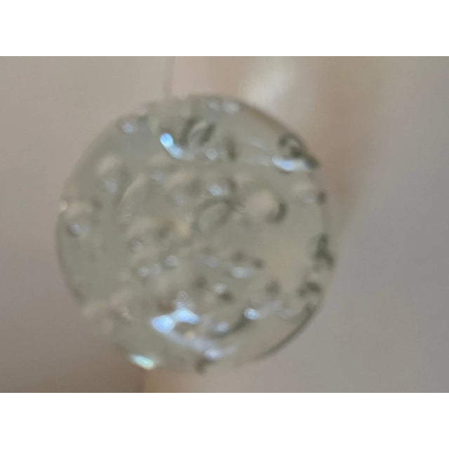 A Clear Glass Paperweight with bubbles. Very large sphere that measure 6 1/8" Large and stunning. a great decorative piece...