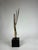 An atract bronze sculpture by Bob Bennett. A modernist touch for the room