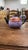 A unique hand-crafted studio pottery teapot featuring a textured lavender and multicolor speckled body contrasted by a...