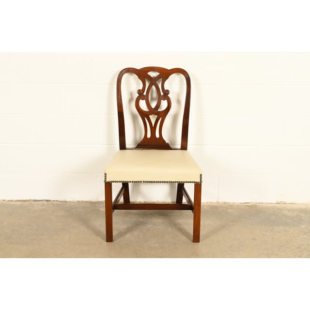 An outstanding Georgian or Chippendale style side chair or dining chair By Baker Furniture USA, Circa 1980s Carved solid...