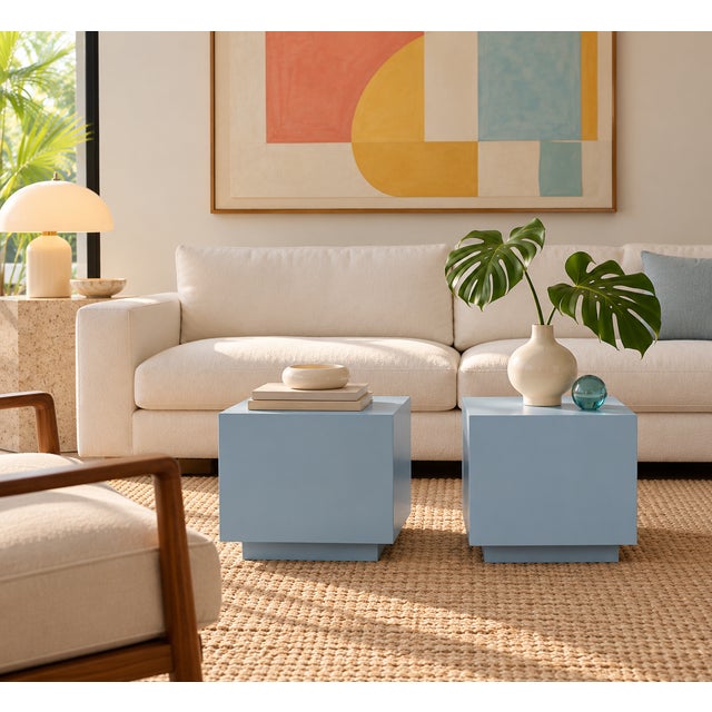 A striking pair of 1980s laminate cube side tables with a clean, architectural presence. Finished in a soft powder-blue...