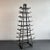 This custom-made Industrial tall cast-iron tower features 9 levels of upturned racks that taper to 22 inches x 8 inches on...