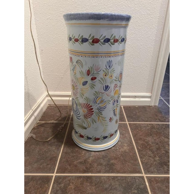 This is a hand-painted porcelain umbrella stand created and manufactured by the Henriot Quimper Faience factory, a...