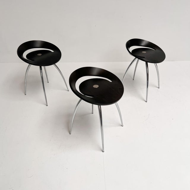 Organically shaped stools by Sigurdur Thorsteinson for Magis. The black stool is recognizable by its bent beechwood...
