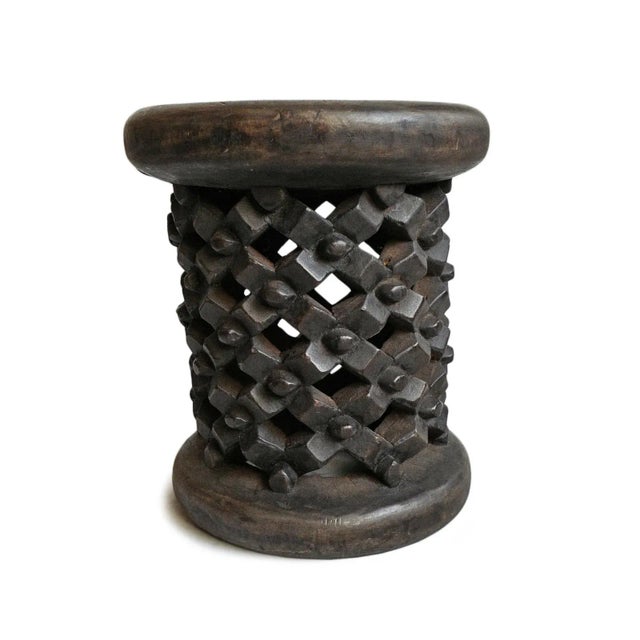 Authentic hand carved Bamileke tribal wood stool. Masterfully crafted from one piece of indigenous wood. Impressive and...
