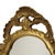 Mid-century crest mirror in a classic gold resin frame, Hollywood Regency style, France, second half of the 20th century....