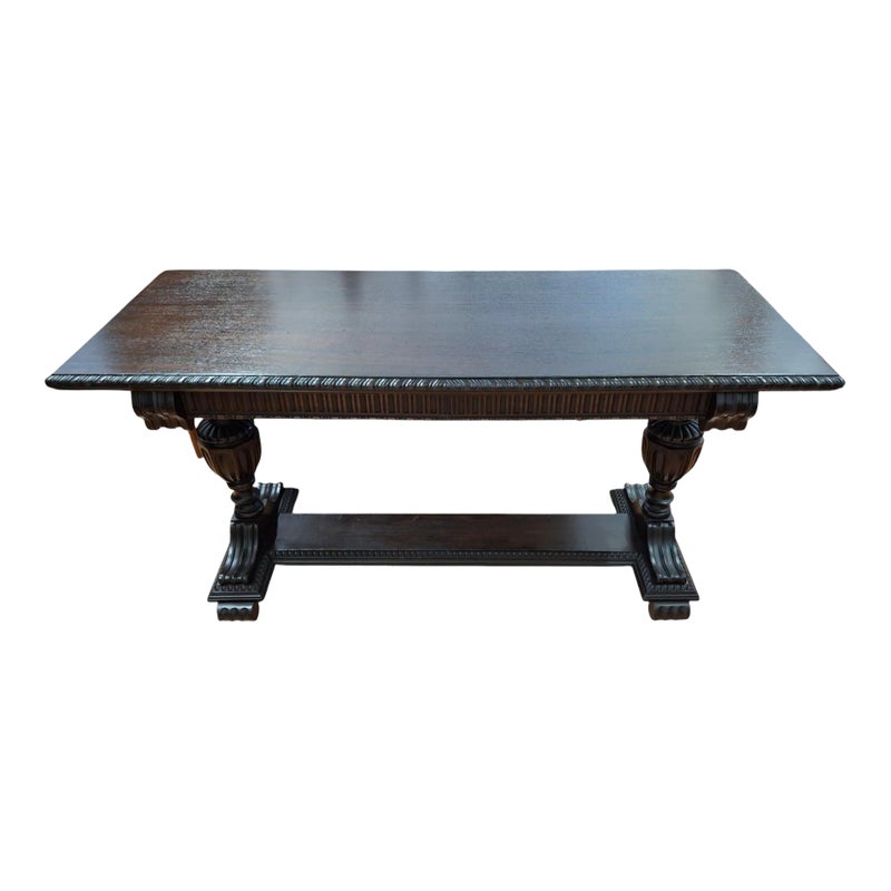 Dark brown wooden table with ornate legs