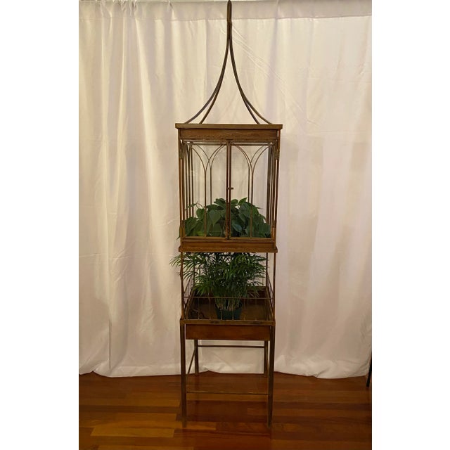 Large 85.5” tall statuesque antique wrought iron and glass Wardian case. This case consists of four separate sections,...