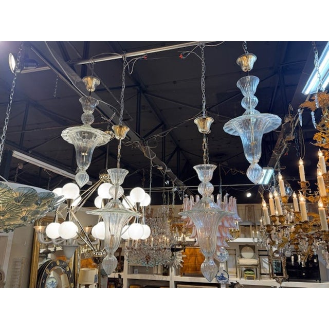 Decorative Clear Murano Glass lanterns in a bell shape. A stylish choice for a fine home. Two available, priced each. 14w...