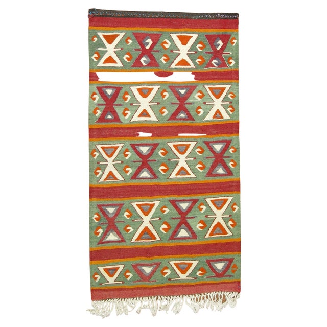 Geometric mid-20th century Turkish Kilim in green, red, and orange 2'8'' x 4'9'' circa mid-20th century.