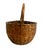 On offer is an antique, hand-woven American utilitarian gathering basket, dating from the late 19th century to the early...