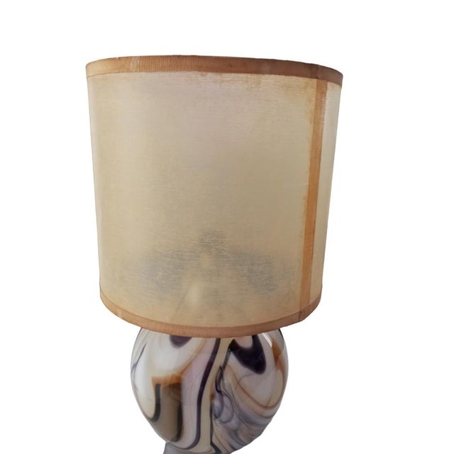 Italian table lamp with a spherical base in Murano glass, from the 1970s. The glass features brown shades with a marble...