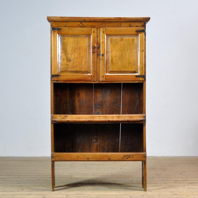 This Spanish cabinet from circa 1800 is crafted from solid chestnut wood and embodies timeless craftsmanship. The piece is...