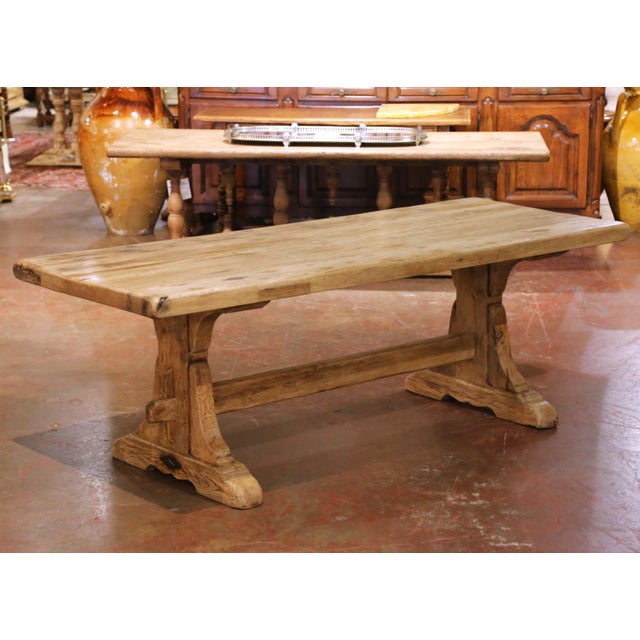 Crafted in France circa 1780, this antique monastery refectory table embodies the strength and rustic character of...