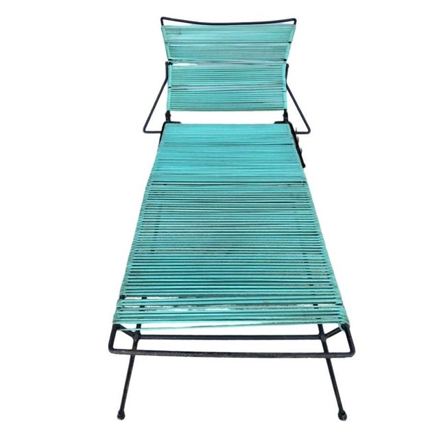 Water Lamb inspired black iron outdoor / patio chaise lounge featuring teal nylon cord seats. Produced by the Woodard...