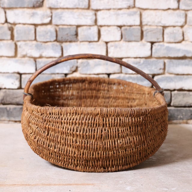 Early 20th-century French wicker gathering basket with a generous, handwoven form and sturdy handle. Both functional and...