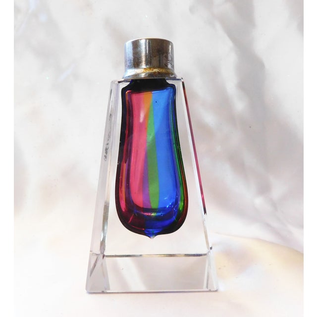 This is a crystal Imperlux Perfume Bottle with colors of blue, pink green and maybe yellow. The bottle is solid crystal,...
