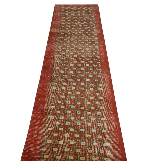 Hand knotted in Turkey originating between 1950-1960, this vintage mid-century wool runner is the latest to join Rug &...