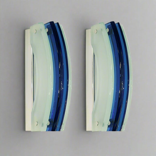 Pair of Modernist Italian Art glass sconces by Veca. Blue and frosted glass curved panels mounted on a chromed metal base....