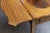 This is a fine George III English Pembroke table crafted in satinwood with richly figured mahogany crossbanding and...