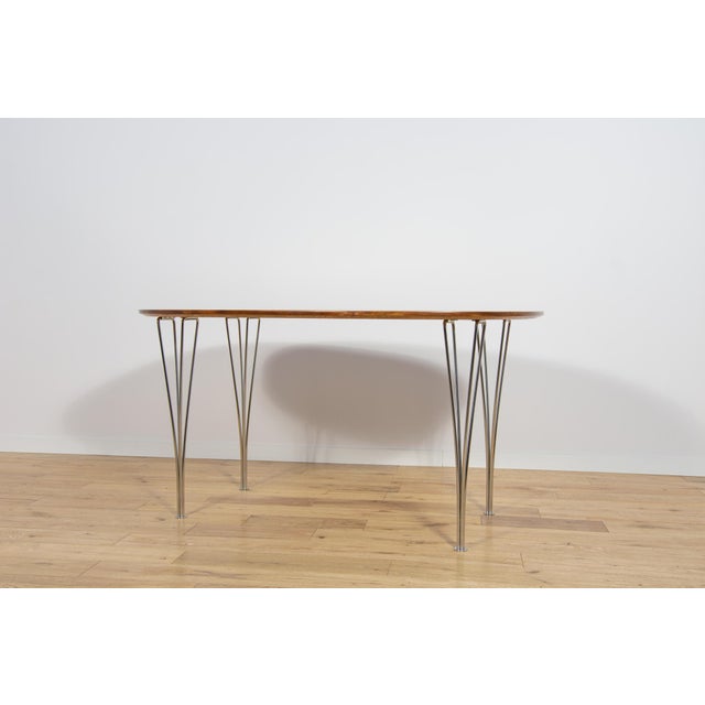 The Superellipse table was designed by Piet Hein and Bruno Mathsson for the Danish manufacturer Fritz Hansen in the 1960s....