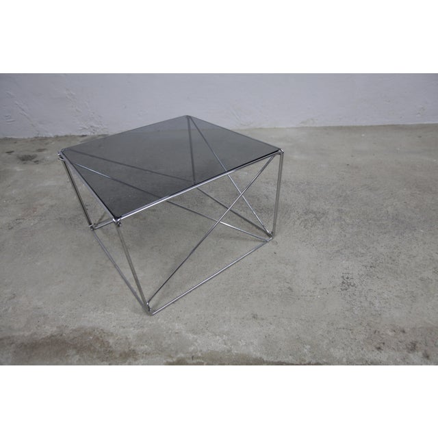 Coffee table by Max Sauze, Isocèle collection, 1970. New gray glass top with rounded edges. Chrome-plated steel base in...