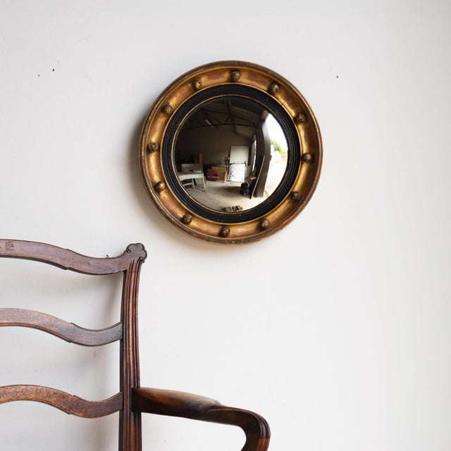 ANTIQUE CIRCULAR MIRROR A handsome mirror of fairly small proportions. A hand carved circular pine frame with gilt gesso...