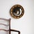 ANTIQUE CIRCULAR MIRROR A handsome mirror of fairly small proportions. A hand carved circular pine frame with gilt gesso...