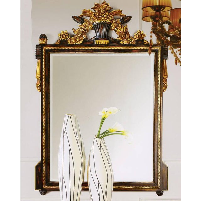 Handcrafted in Italy, this wall mirror features a solid wood frame with intricate hand-carving. The beveled clear glass...